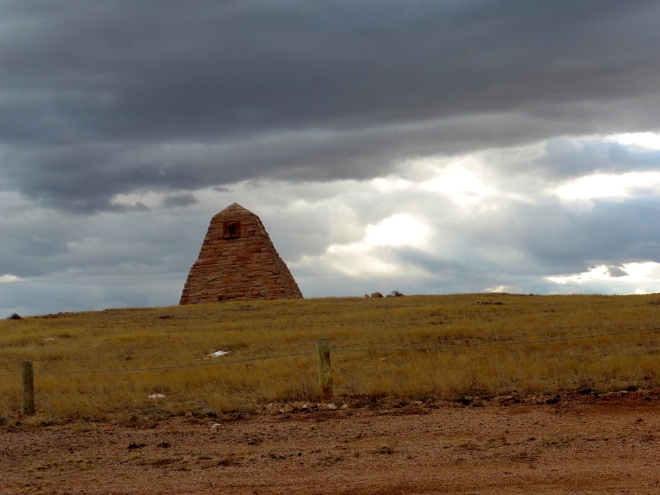 Monument in Wyoming with storm clouds